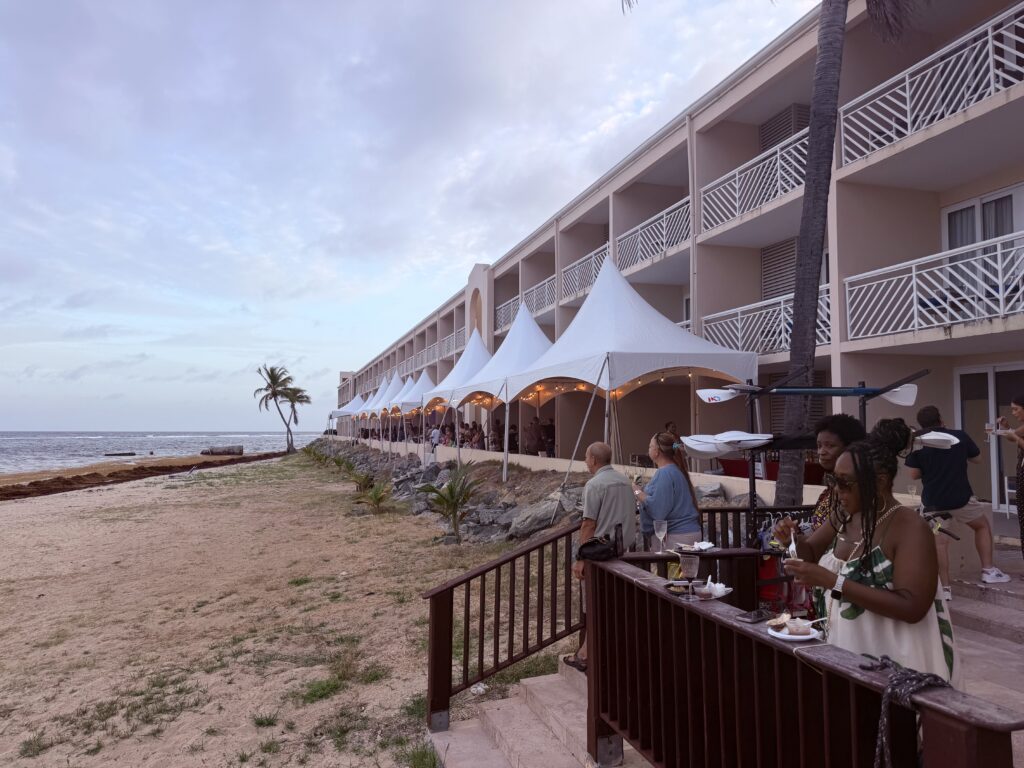 : Taste of St. Croix 2026 white tents along the beachfront at Divi Carina Bay Resort